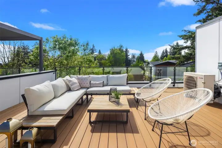 Rooftop Deck with Glass Railings and Timbertech Decking and Exterior Lights Rooftop Deck with Glass Railings and Timbertech Decking and Exterior Lights