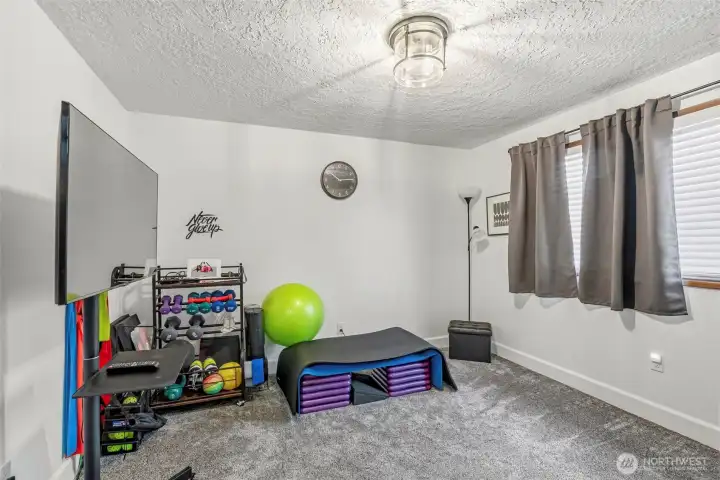 Bedroom #showcases the same high-quality updates found throughout, complete with new flooring, fresh paint, and modern lighting.2