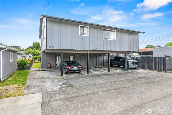 Convenient designated parking! Each unit includes its own covered carport space located at the rear of the property