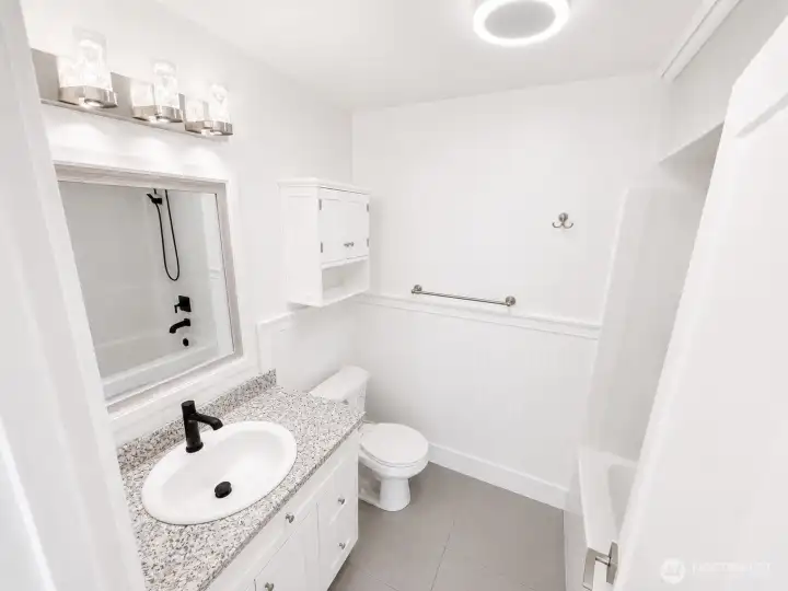 upstairs hallway bathroom with smart speaker