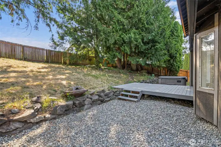 Enjoy the private backyard just steps from the lake and your own hot tub!