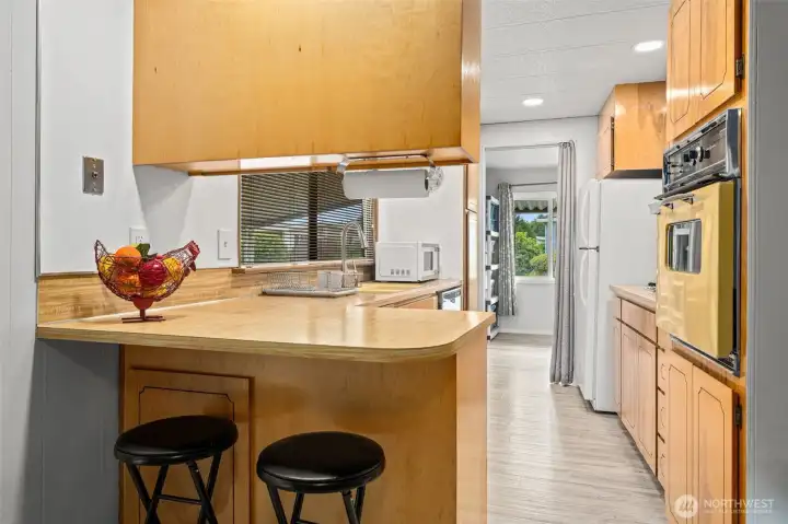 Comfortable kitchen with peninsula for additional storage and seating. Comfortable kitchen with peninsula for additional storage and seating.