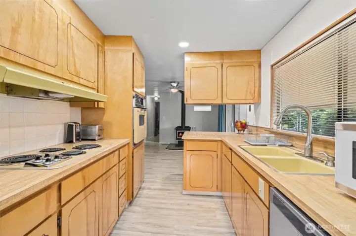 Lots of cabinetry and a big window over the sink! Lots of cabinetry and a big window over the sink!