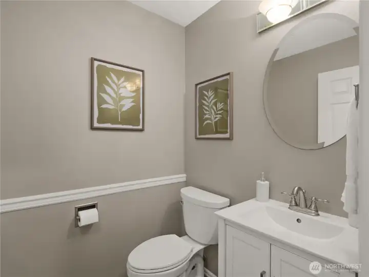 Showcasing timeless finishes and contemporary style, the powder room offers an elegant and convenient space for guests. Showcasing timeless finishes and contemporary style, the powder room offers an elegant and convenient space for guests.