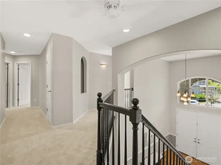 A graceful overlook to the grand two-story foyer adds architectural interest and an airy sense of space to the upper level. A graceful overlook to the grand two-story foyer adds architectural interest and an airy sense of space to the upper level.