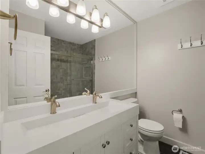 This updated bathroom provides a comfortable and inviting space for daily routines. This updated bathroom provides a comfortable and inviting space for daily routines.