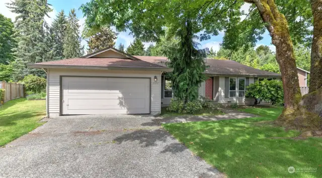 Ample driveway parking and a two-car garage.