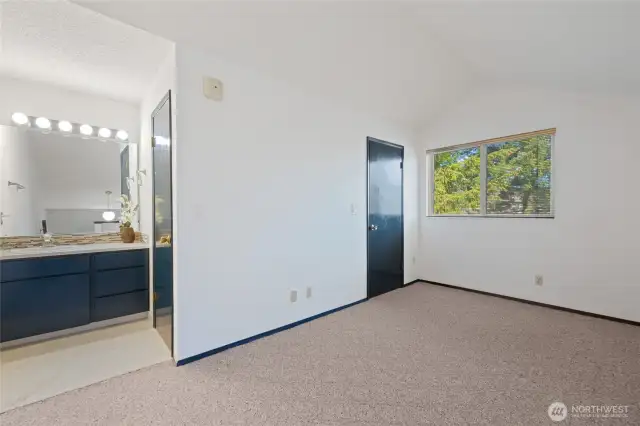 Bedroom showing full bath on the upper floor to the left of photo