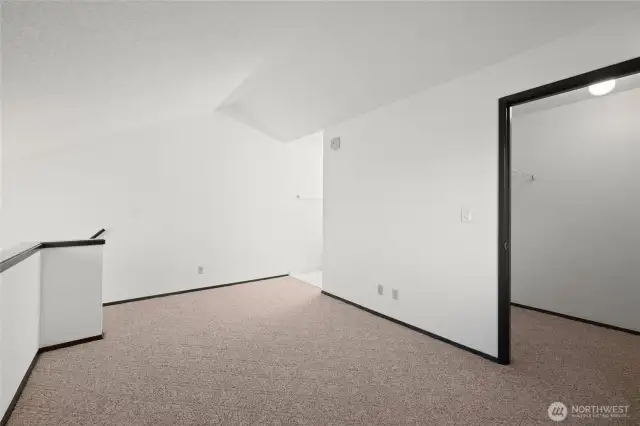 Second floor bedroom showing walk-in closet to the right