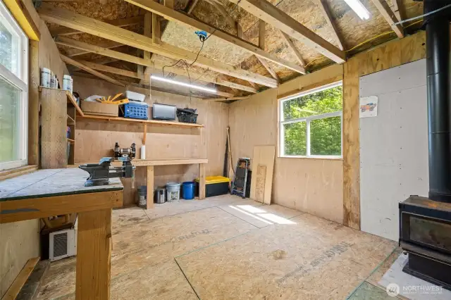Outbuilding interior with wood burning stove