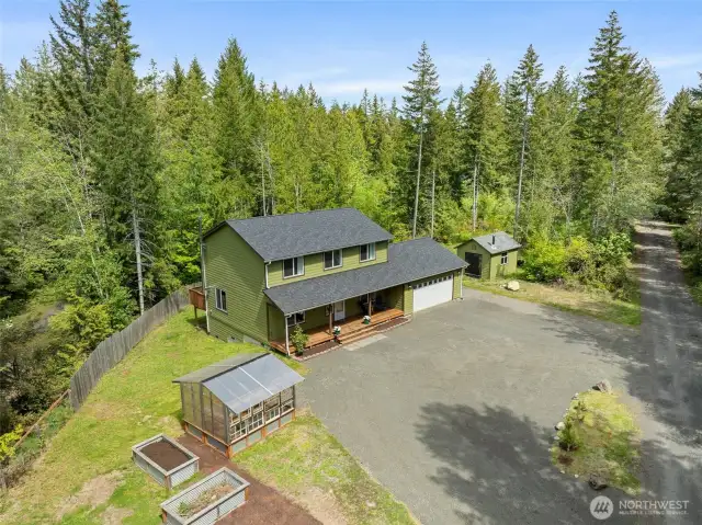 Ariel view of property with large driveway area