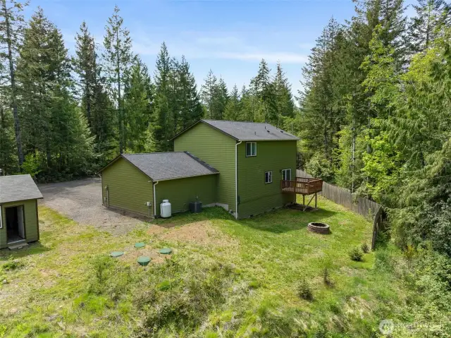 Back of the house and firepit