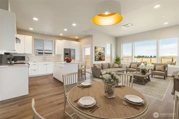 Living/kitchen, staged photo of a different unit but the same Cypress model for reference only.