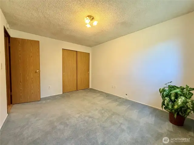 Another view of the primary bedroom.