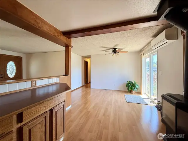 Dining area and slider to back of home.