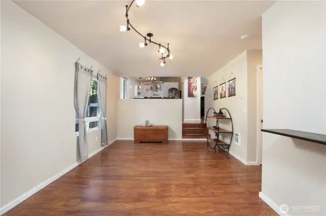 View from the family room on lower level looking to the main floor with kitchen beyond.