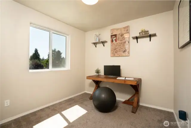 Third of three bedrooms on upper level.