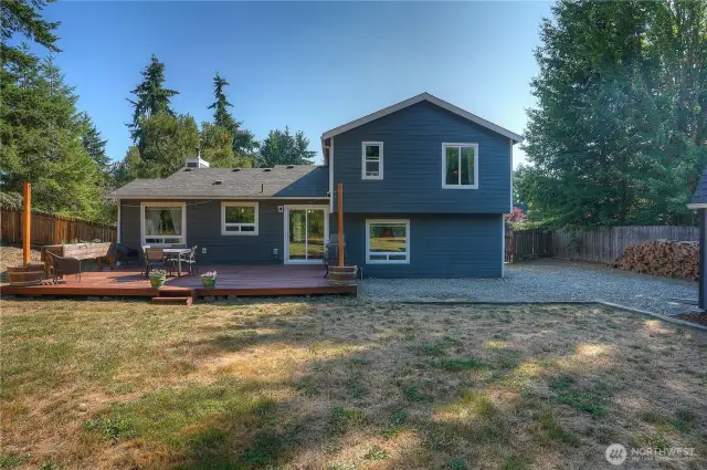 Relax and enjoy your morning coffee in peace and tranquility on your private deck! Load of potential with this great backyard!