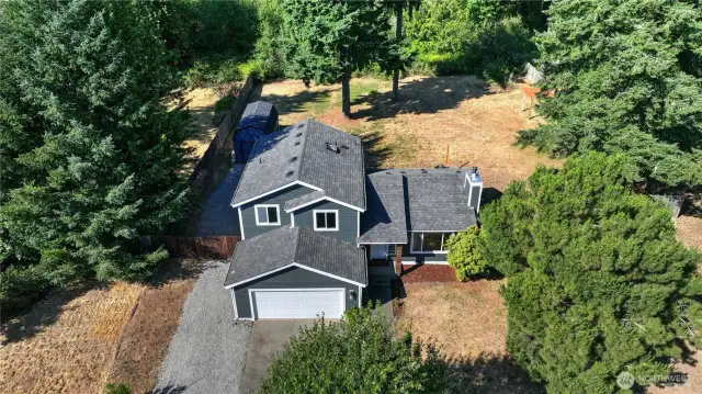 This half acre lot offers lots of space and privacy. The back of the property abuts a green belt for added seclusion.