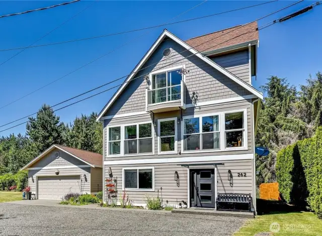 The home faces south and has 2 covered parking spaces in the garage plus ample space in front.