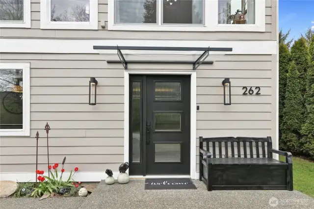 Updated metal and beveled glass front door.