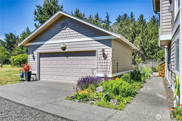 Detached garage with shop space and room for two vehicles.