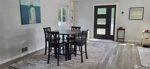 Entry level entry via the metal and beveled glass door to the informal dining area.