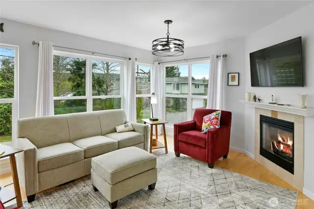 The second floor wall of windows showcases partial water views.