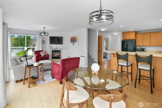 Another view of the great room shows off the convenience of the near by kitchen and a bedroom & bath down the hall. This home has a bedroom & full bath on each floor making it ideal for multigenerational living or entertaining.