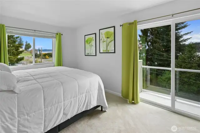 The 3rd floor bedroom with a water view and a full bath just outside the doorway.
