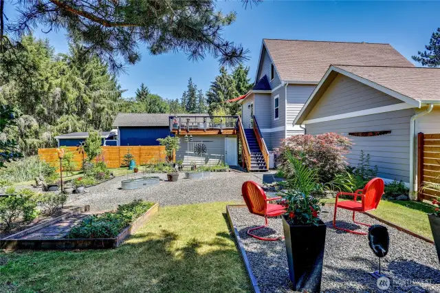 Plenty of yard spaces to enjoy. Note the enclosed space under the raised deck for locked storage.