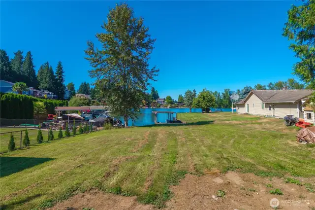 Welcome to Lake Tapps! This lovely lakefront lot is ready for you to build! Located on a protected cove, you can enjoy warmer waters, less boat wake, and a boat house to park your power or pontoon boat! There is 50' of frontage.