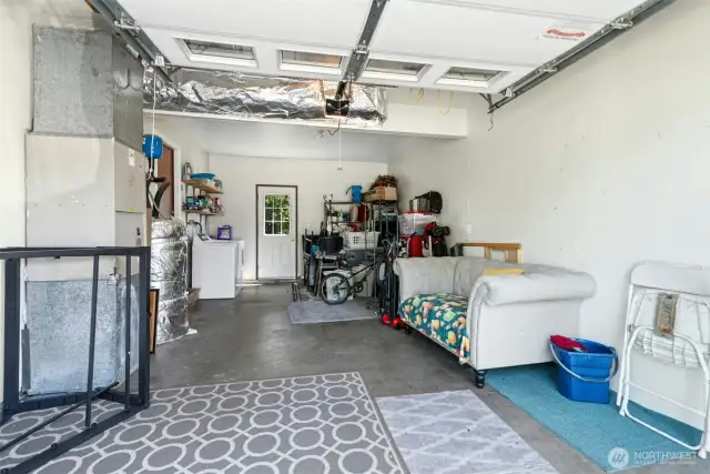 Spacious 1-car garage in updated unit. Garage in second unit has been converted to a bedroom with heat & closet space. Bedroom can be easily converted back to garage.