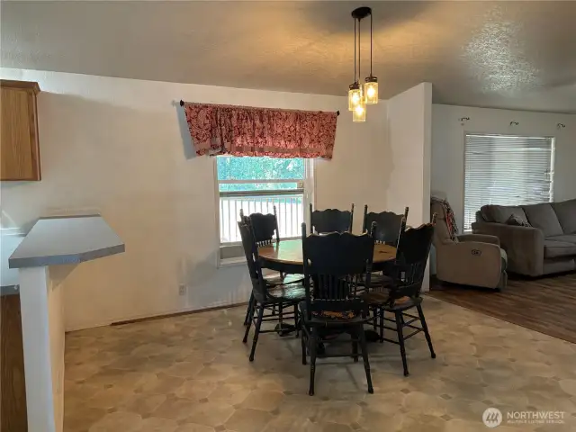 As you walk through the living room you open up to the kitchen on the left, dining room straight ahead and rec room on the right.