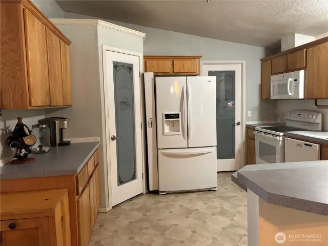 You also have a pass through laundry room off the kitchen, also with labeled door.