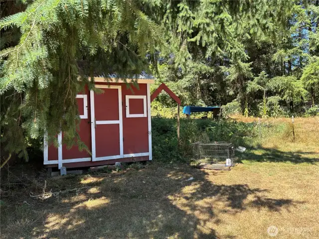 Outbuilding with pen area.