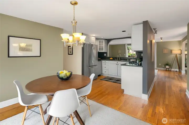 Updated kitchen with granite counters, stainless appliances with an abundance of cabintes.