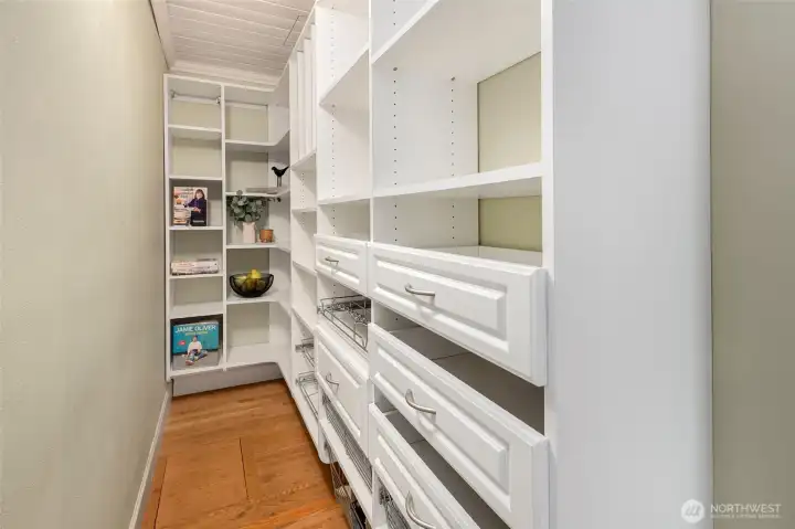 Thoughtful design of an walk in pantry with California Closet built- ins.