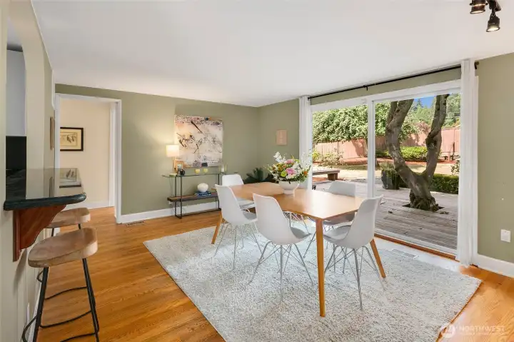 New carpet in space off kitchen with sliding doors to the front yard.