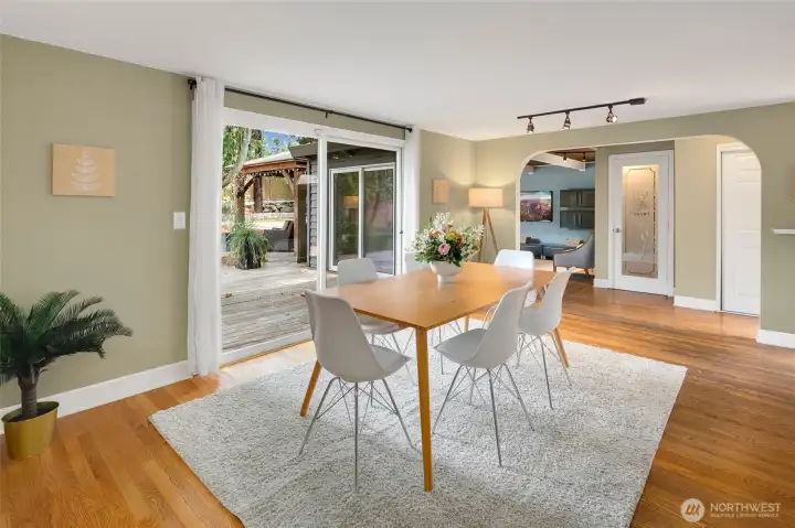 Formal dining with breakfast bar to the kitchen and sliding doors to the backyard deck.