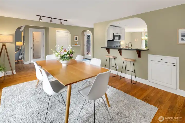Formal dining with breakfast bar to the kitchen and sliding doors to the backyard deck.