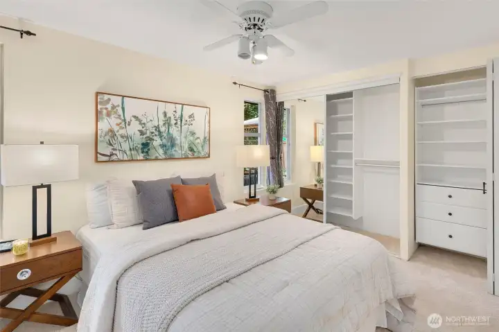 Primary bedroom with ensuite bath and California Closet built-ins.