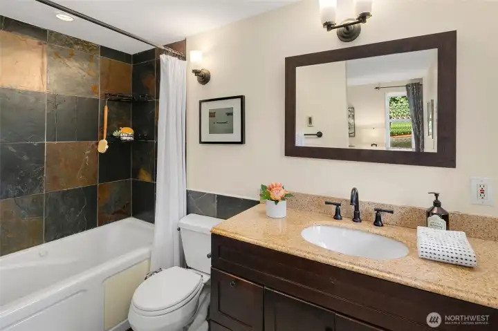 Primary bedroom with ensuite bath and California Closet built-ins.
