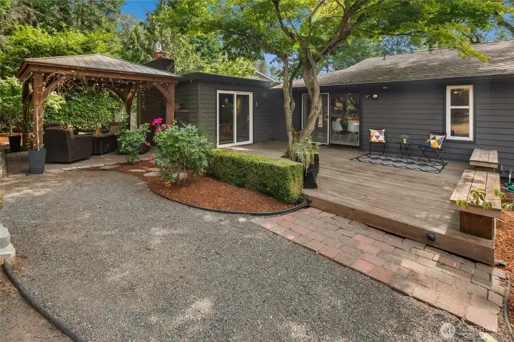 Deck off the living room and dining room, gazebo on the left.