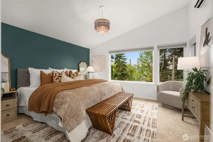 The primary bedroom is spacious enough for a king bed, plus side tables! Have you noticed the custom light fixtures throughout the home?