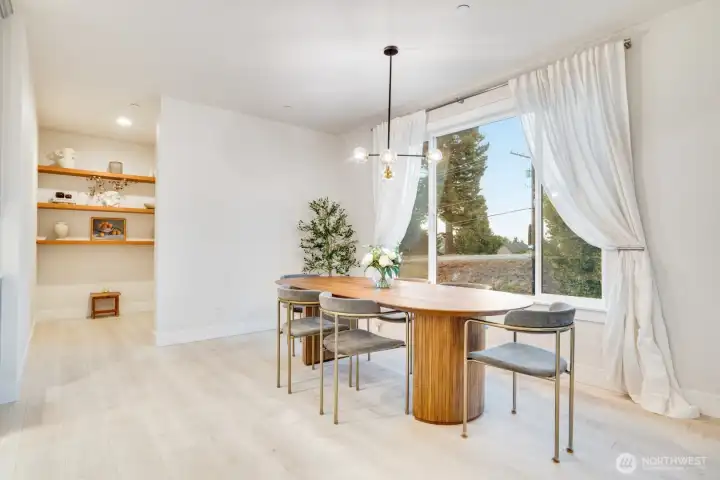 To the left of additional open shelving for overflow storage and walk-in pantry.