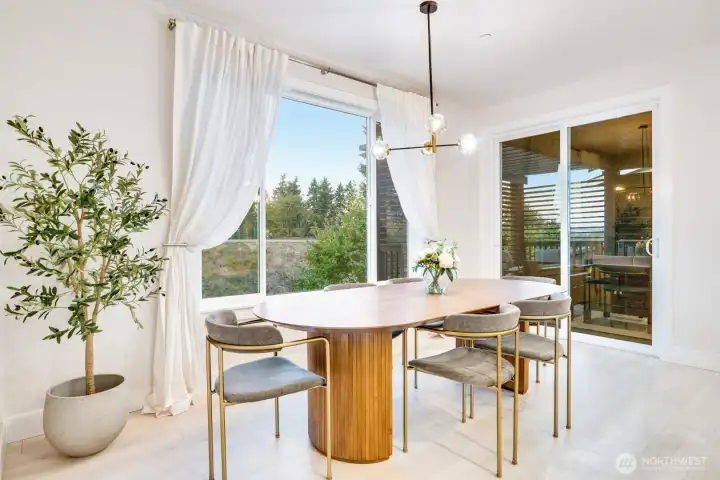 Formal dining with immediate access to the covered privacy deck.