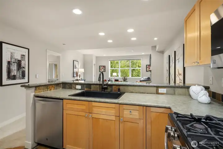 The kitchen also features a beautiful granite composite sink.