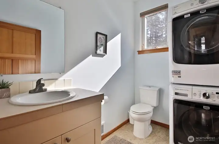 Half-bath installed at time of construction with its own grinder pump —$15,000 or more added value with laundry upstairs!
