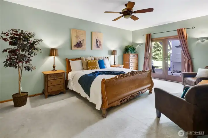 The primary suite is spacious and features access to the back patio